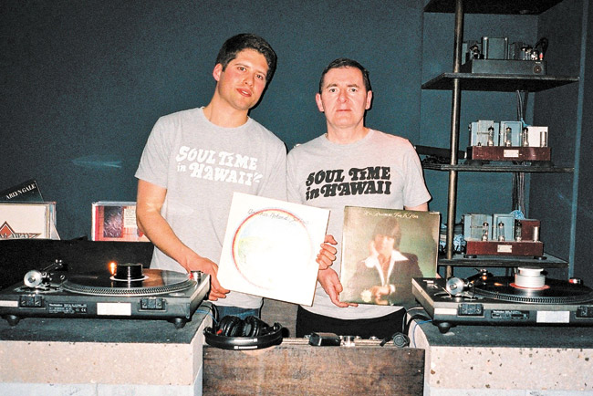 London DJs Cedric Bardawil (left) and Mark Taylor show off local LPs by Brother Noland (record on the left) and Hal Bradbury at the Soul Time In Hawaii party in London. Photo courtesy Cedric Bardawil 