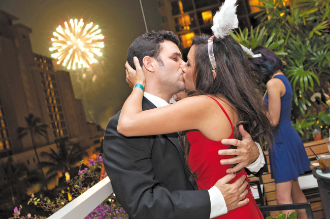 A couple rings in the New Year at Trump Hotel Waikiki's annual Casino Royale party PHOTO BY ANTHONY CONSILLIO 
