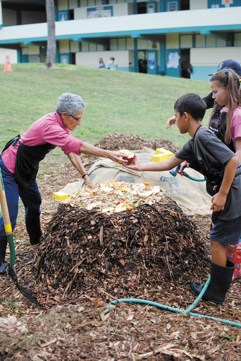 Mindy Jaffe of Waikiki Worm Company teaches Lanikai Elementary students (from left) Kaimi Victor, JoLee Hopkins and Henry Cullison how to use food waste for hot compost. Jaffe's goal is to incorporate this form of vermicomposting into the public school system. 