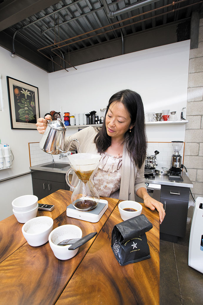Jackie Suiter prepares freshly ground Kona coffee in a Chemex coffeemaker