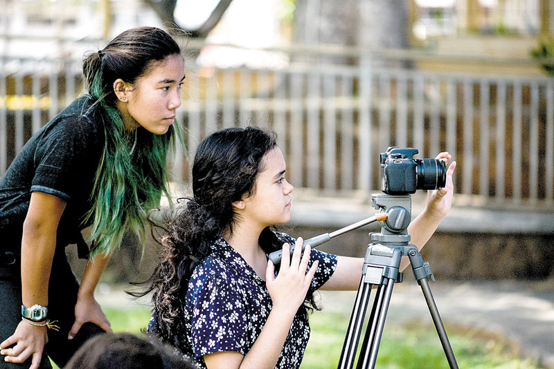 Mae Sebastian (left) and Emma Oshiro work together during a recent Basic Reel Camp class with Hawaii Women in Filmmaking VALERIE NARTE PHOTO 