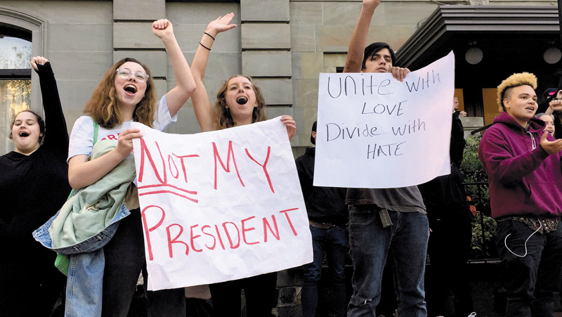 Several dozen high school students in the Portland metropolitan area gather downtown to protest Republican nominee Donald Trump's victory in Tuesday's presidential election. The protests were peaceful GILLIAN FLACCUS/AP PHOTO 