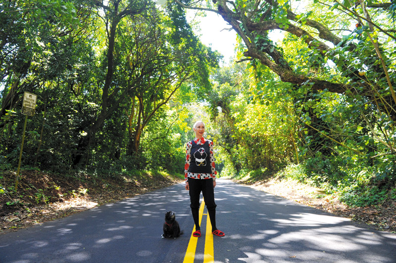 Christa Wittmier with her dog BooBoo on Nuuanu Pali Drive, which is one of her favorite places LAWRENCE TABUDLO PHOTO 