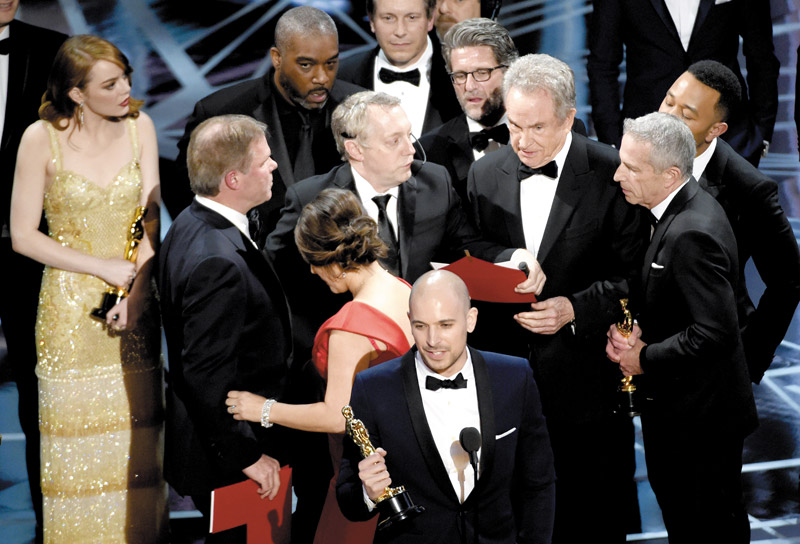 ‘La La Land' producer Fred Berger gives his acceptance speech as chaos develops behind him. The Best Picture Oscar went to ‘Moonlight' in the end AP PHOTO 